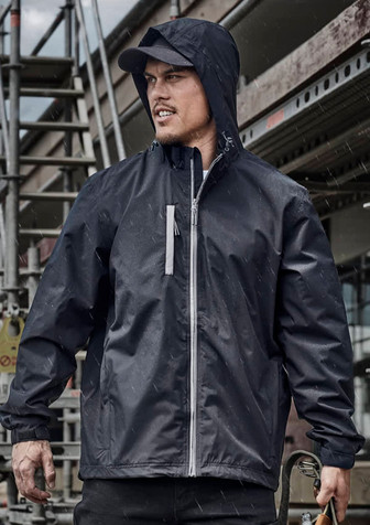 A unisex super light packable rain jacket in black, featuring a hood and zippered pocket, against a construction backdrop.