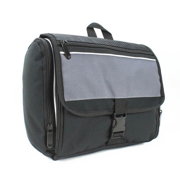 A black and grey toiletry bag with zippers and a flap closure, featuring a handle and an integrated logo.