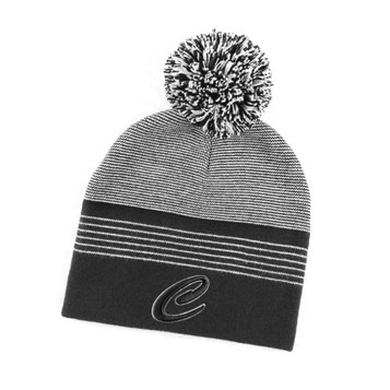 A black and grey striped beanie with a pom-pom on top and a logo at the front.