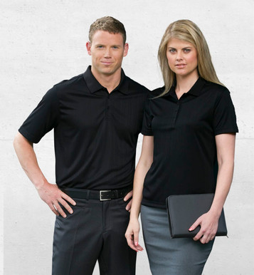 A black Dri Gear Corporate Pinnacle Polo for women, featuring a logo, paired with tailored grey bottoms.