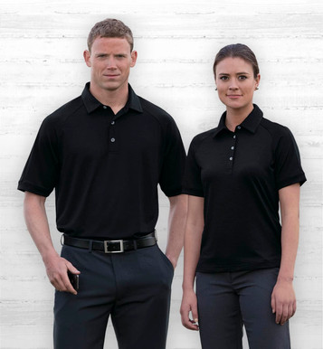 A black women's polo shirt with a subtle texture and a logo displayed, modelled by a woman.