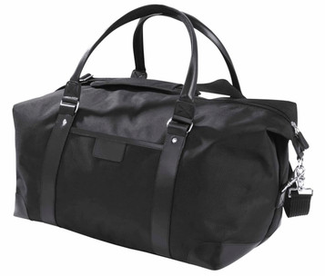 A black duffle bag with leather accents and sturdy handles, featuring a zipped closure and a detachable strap.