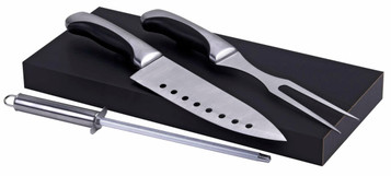 A stainless steel carving set featuring a knife, fork, and honing steel on a black wooden base.