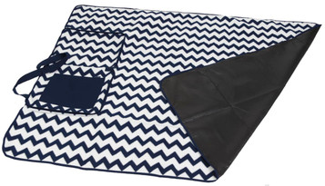 A patterned outdoor blanket featuring a navy and white chevron design, with a solid black underside and a pocket.