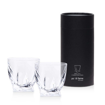 A whisky glass set featuring two clear, intricately designed glasses packaged in a sleek black cylindrical box.