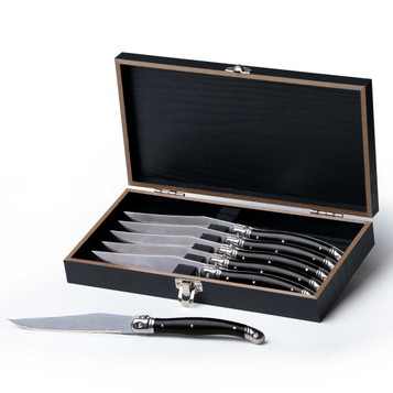 A knife set featuring six stainless steel knives with black handles, presented in a stylish black wooden box.