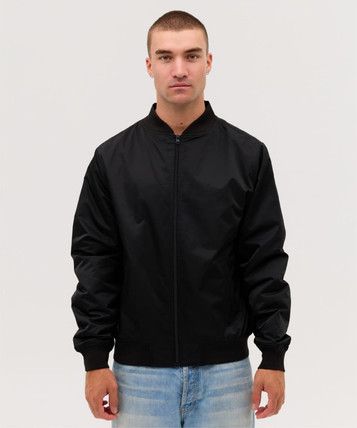 A black bomber jacket with a zip front and ribbed cuffs, worn by a model against a plain background.