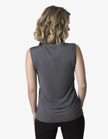 A grey ladies' sleeveless polo shirt displayed on a model with a casual pose. The shirt includes a collar and has a logo.