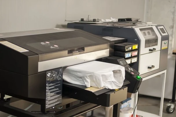 Direct to garment printer printing a full-colour design