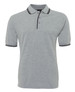 A grey polo shirt with contrasting black stripes on the collar and sleeves. It features a three-button placket and a logo.