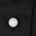 A black fabric close-up featuring a white button, showcasing a clothing accessory in a textured finish.