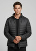 A puffer jacket in black, featuring a zip-up front and a modern, fitted design, with a logo on the chest.