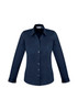 A navy women's button-up long sleeve shirt with a sleek design and a classic collar. It features a brand logo.