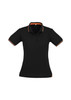 A black women's polo shirt featuring short sleeves and orange accents with a logo.