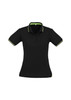 A women's black polo shirt featuring short sleeves and green accents. The shirt has a collar and branding.