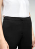 Black women's slacks feature a sleek design, shown with a light-coloured shirt. The waistband is smooth and tailored.