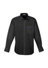 A black long sleeve button-up shirt with a chest pocket and a collar. It features a logo on the label.