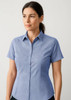 A short-sleeve button-up shirt in light blue, featuring a checkered pattern and a collar. It has a logo on it.