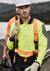 A men's hi-vis long sleeve polo in bright yellow and navy, featuring safety harness and gloves, with a logo.