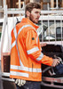 A bright orange unisex hi-vis softshell jacket with reflective stripes, displayed on a male model.
