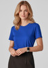 A blue women's short sleeve jersey top with a round neckline, worn by a model with wavy hair.