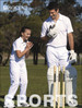 A cricket short sleeve polo in white, featuring a logo, worn by a man and a girl on a grassy field.