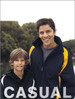 A reversible sports jacket in navy and yellow, worn by a man and a boy, with a logo visible on the jacket.