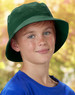 A green soft washed bucket hat worn by a child with a blue shirt, featuring a subtle logo. Background is blurred.