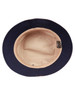 A navy blue bucket hat with a light-coloured interior, featuring a branding label inside.