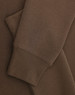 A brown crew fleece jumper with visible cuffs and fabric texture detail. Features a logo.