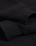 A black 1/2 zip collar fleecy jumper with visible sleeve cuffs and a subtle logo.