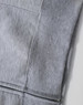 A grey men's full-zip fleecy hoodie with visible stitching details and a smooth fabric texture. Features a logo.