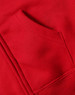 A close-up of a red full-zip fleecy hoodie featuring a front pocket. The fabric appears soft and cozy.