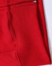 A close-up of a red fleecy hoodie featuring a full-zip and zippered pocket. The fabric appears soft and textured.