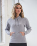 A light grey ladies' fleece hoodie with a front pocket and a drawstring hood. It features a logo.