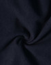 A close-up view of dark navy softshell fabric, featuring a smooth texture with a slight sheen.