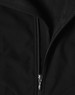 A black softshell vest featuring a zip closure and a textured interior. The vest includes a logo.