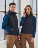A navy padded vest featuring a zip front and side pockets, modeled by a man and woman in casual attire.