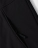 A close-up of a black softshell hoodie with a zippered side pocket and a logo.