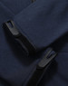 A close-up of a navy softshell hoodie featuring cuff details and a logo.
