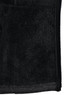 A black ladies' heather bonded fleece jacket featuring a zip closure and soft, textured fabric.