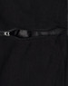 A black Long Line Stadium Jacket featuring a zippered pocket and a smooth lining. The jacket has a branding logo.