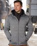 A men's cationic quilted jacket in shades of grey, featuring a zip front and a hood. The model wears a scarf.