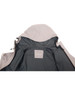 An interior view of a light grey men's waterproof performance jacket featuring a hood and a logo tag inside.