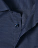 A close-up of a navy blue men's button-up shirt featuring a pin dot pattern and a collar with buttons.