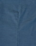 A close-up of a blue pin dot fabric, displaying subtle texture and stitching details typical of a long-sleeved button-up shirt.