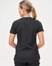 A women’s solid black short-sleeve scrub top featuring a sleek design and a logo on the back.