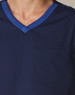 Men's short-sleeve scrub top in navy, featuring a contrast blue neckline and a front pocket. Includes a logo.