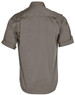 A men's short sleeve military shirt in a plain olive green colour, featuring rolled sleeves and a branding logo.