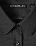 A black ladies' button-up shirt with a pin dot pattern, featuring a collar and a logo label.